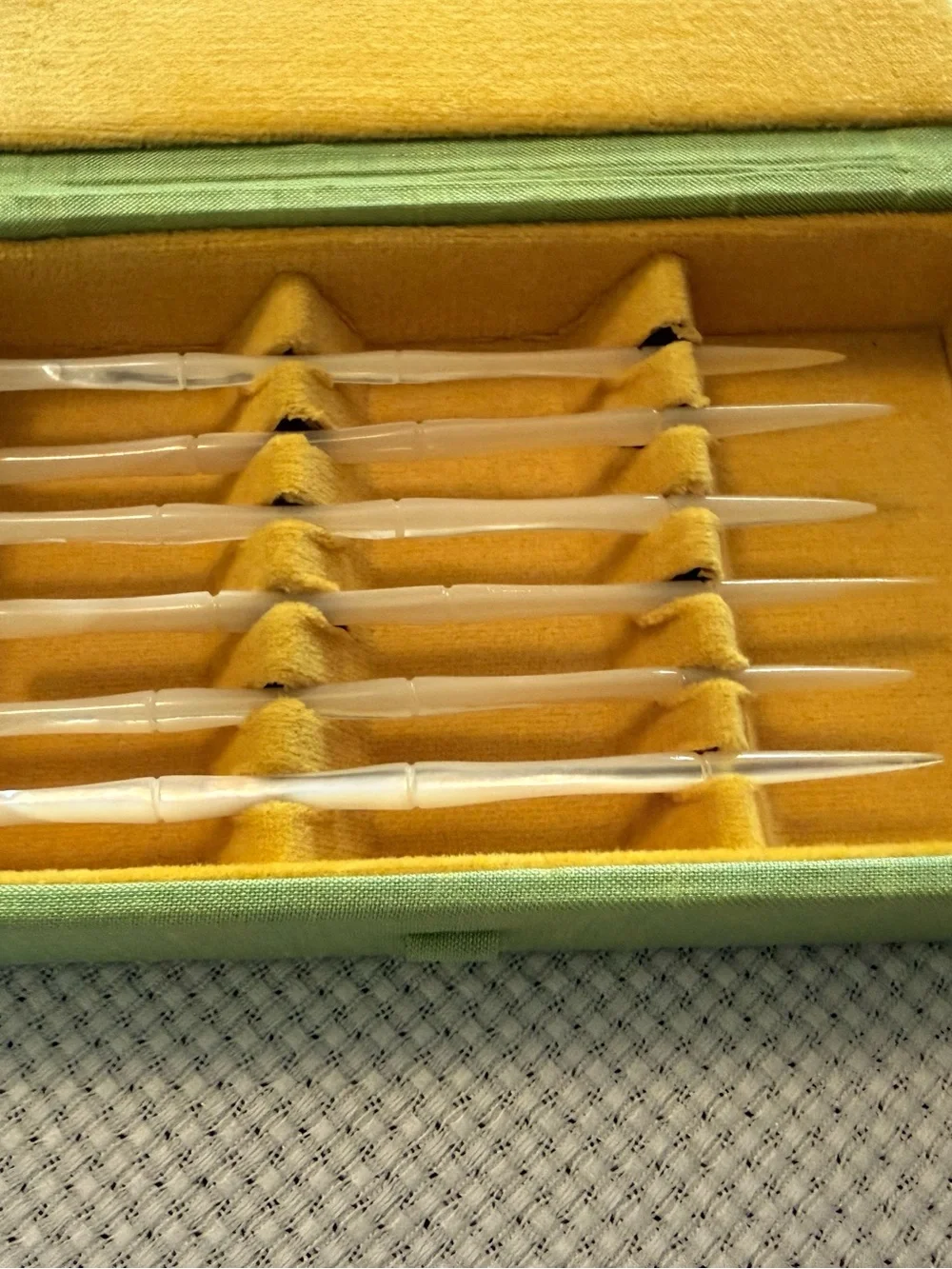 Mother-of-pearl carved toothpicks in velvet case